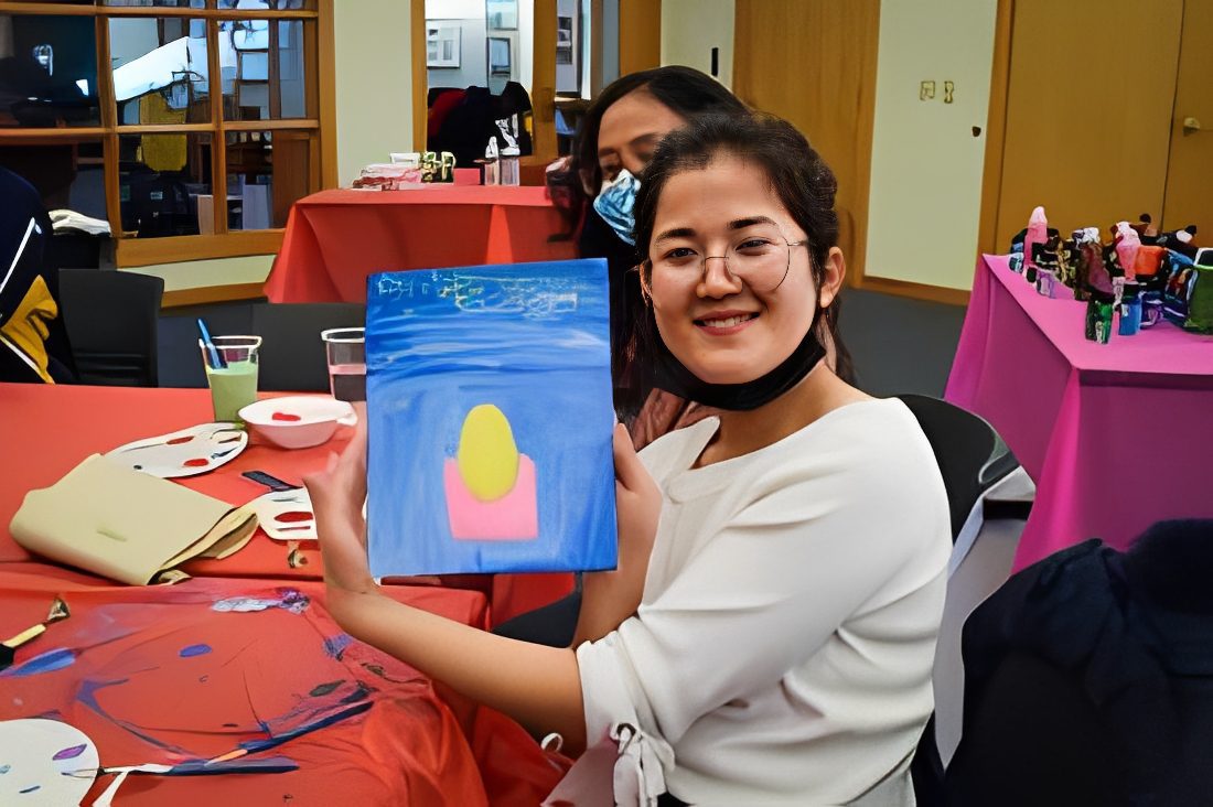 Person holding a colorful painting