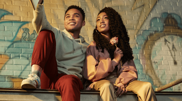 Friends sitting with graffiti background