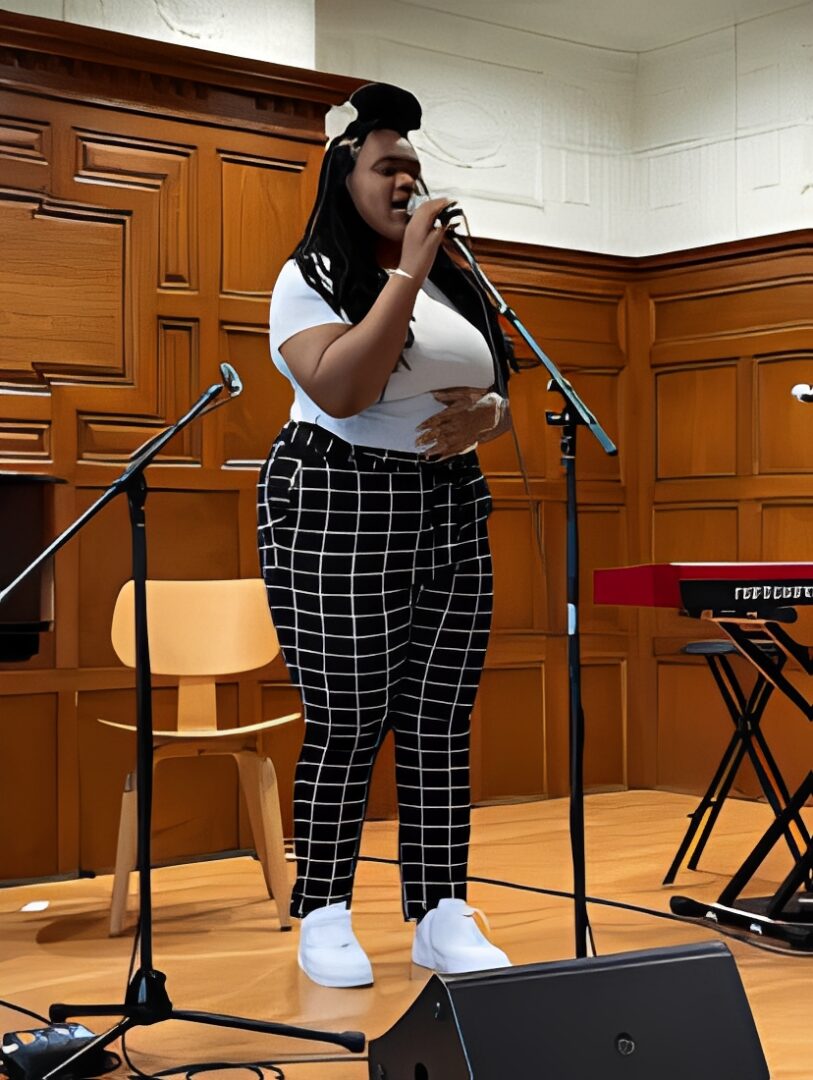Singer performing on stage with microphone
