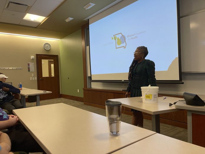 Woman giving a lecture with presentation