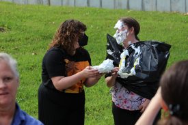 Two people in pie-throwing activity