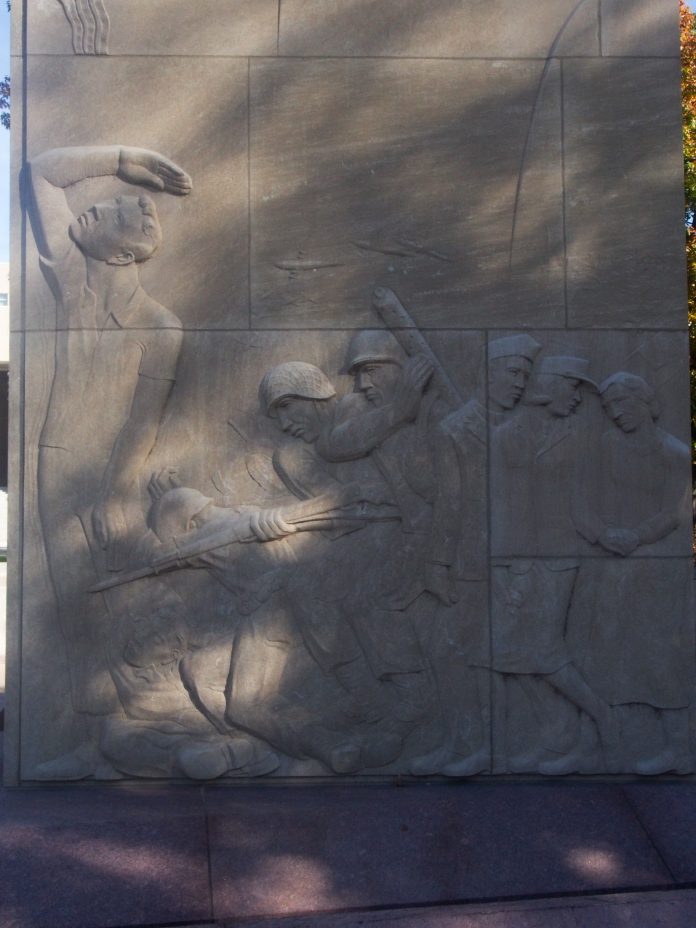 War scene stone sculpture