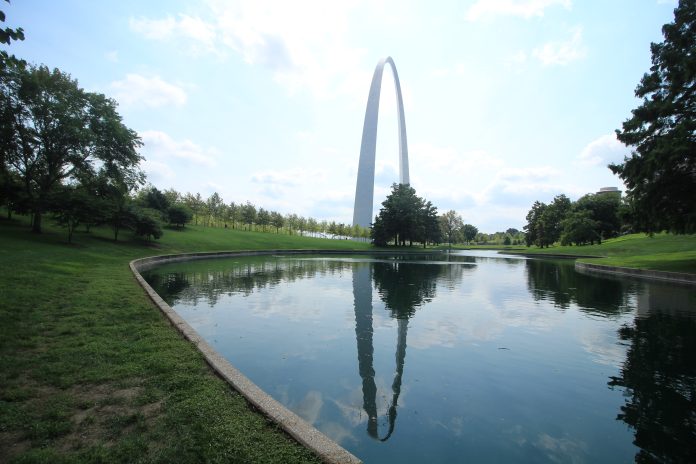 Gateway Arch reflected in pond