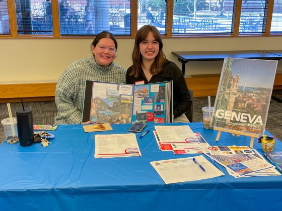Two people showcasing Geneva travel information