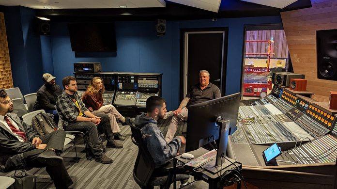Recording studio discussion with group