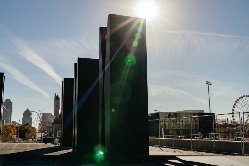 Modern sculpture with city skyline