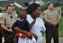 Mothers and teachers comfort children in light of unrest