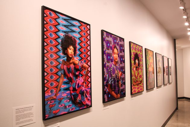Colorful portraits displayed in a gallery