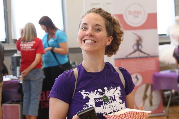 Woman smiling at community arts festival