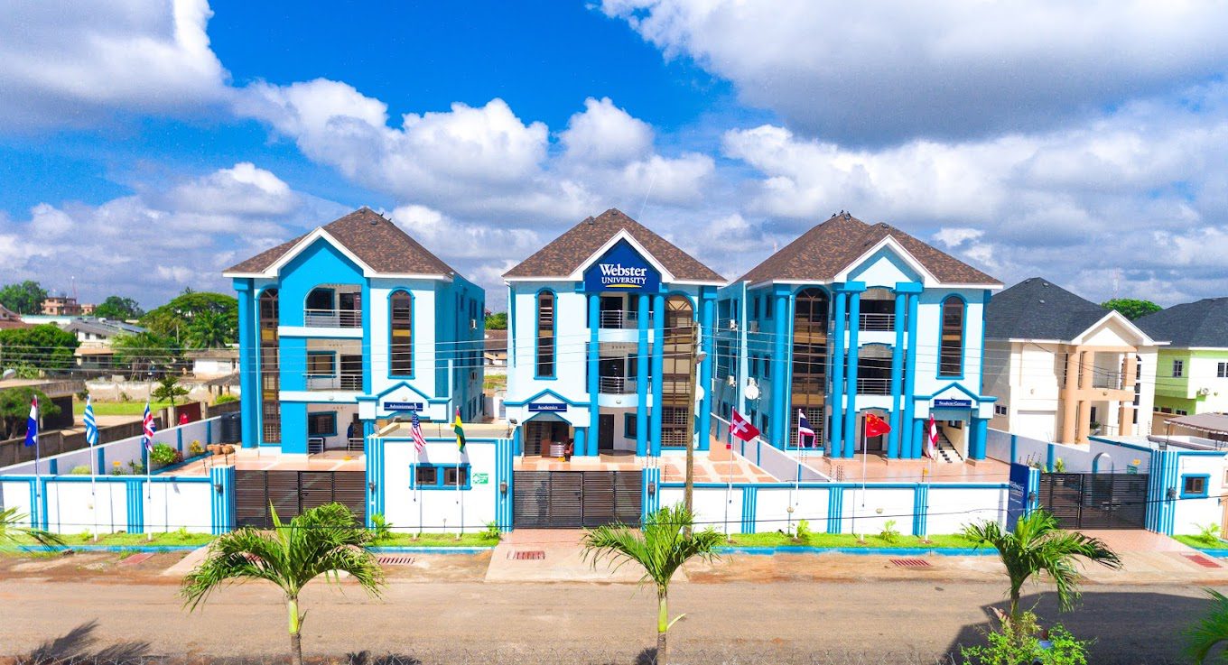 Blue and white building with flags