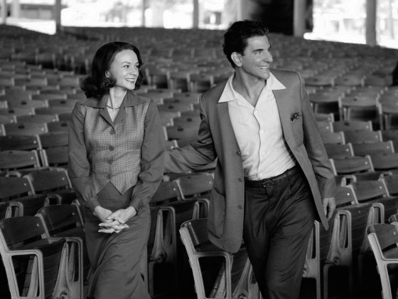Vintage couple smiling in empty theater