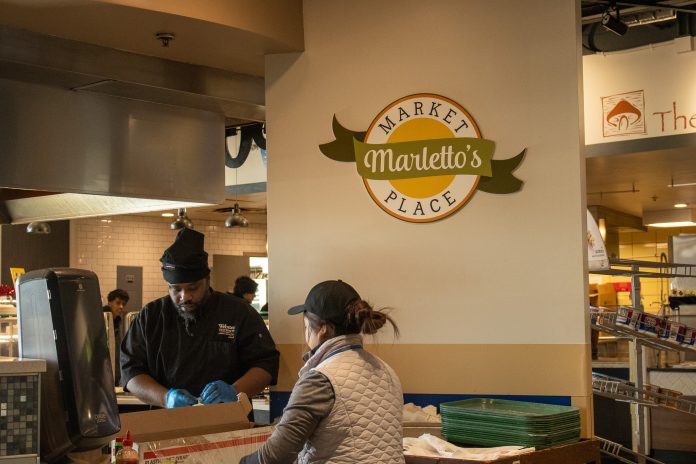 Chefs working in a cafeteria kitchen