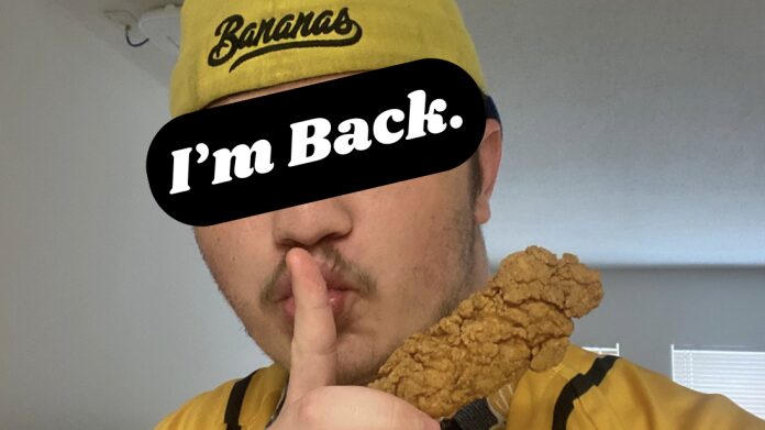 Man in yellow hat with chicken