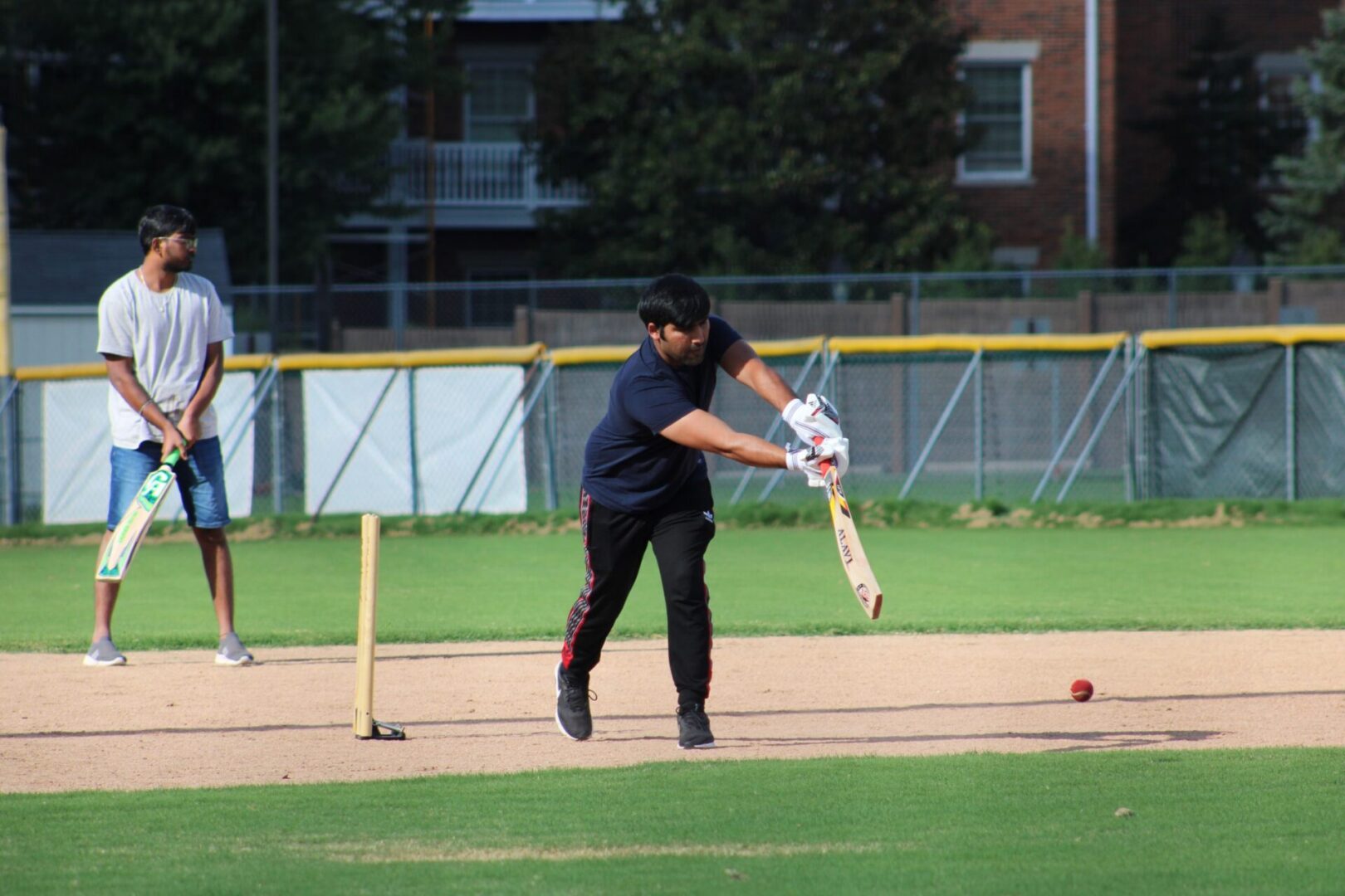 Batsman striking a cricket ball