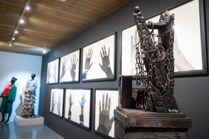 Sculpture with chains in modern gallery