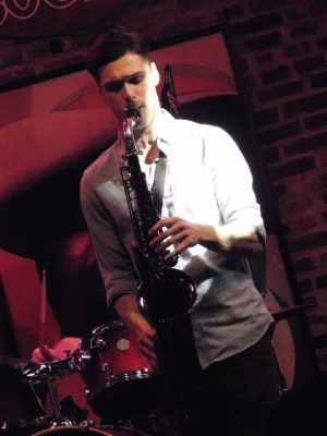 Saxophonist performing at live event