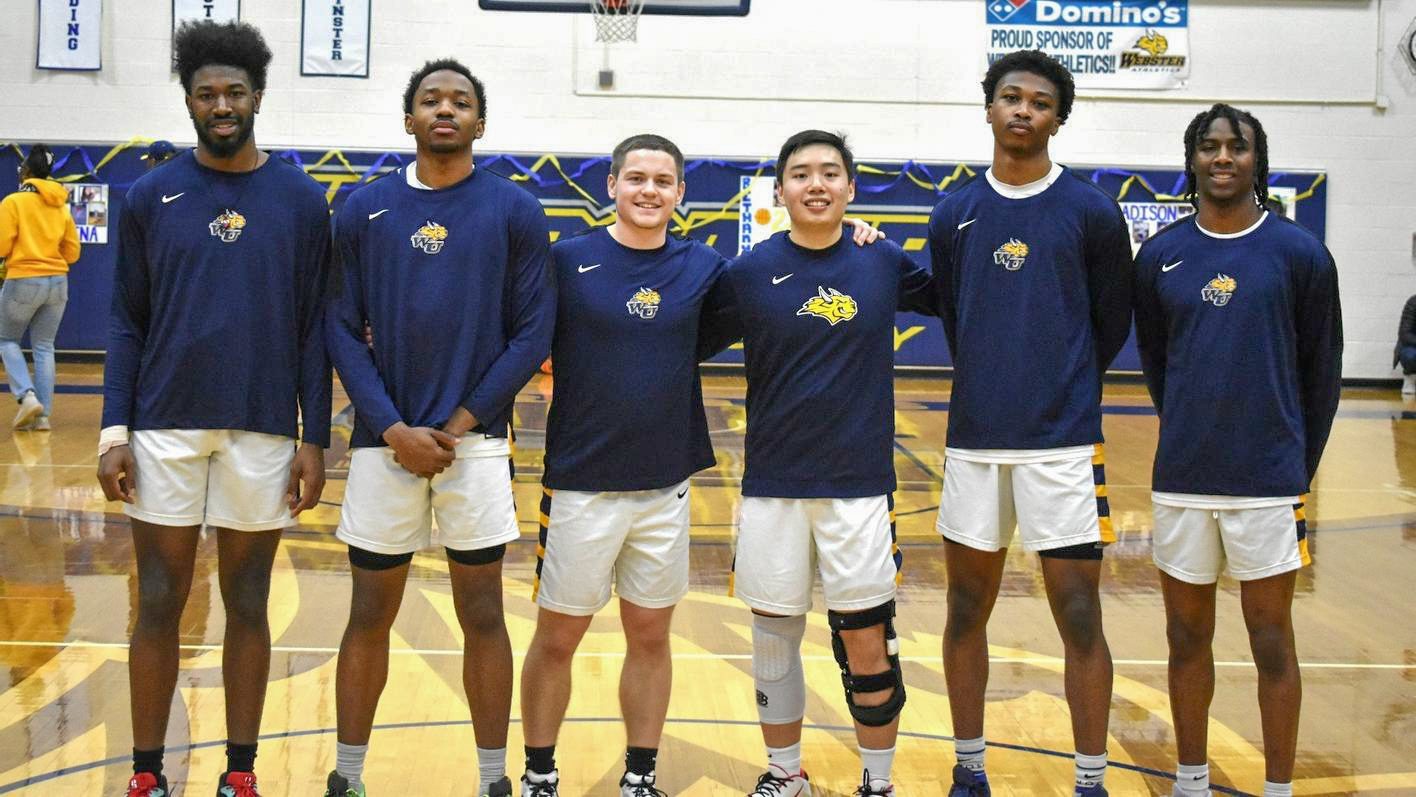 Smiling athletes standing together in gym