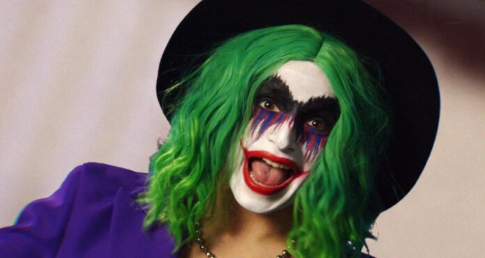 Smiling clown with colorful makeup