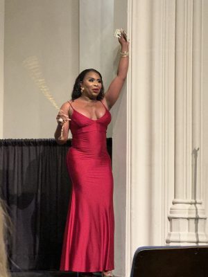 Elegant woman in red gown at event