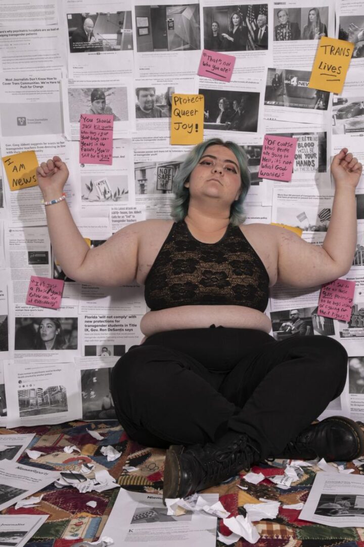Individual surrounded by paper notes