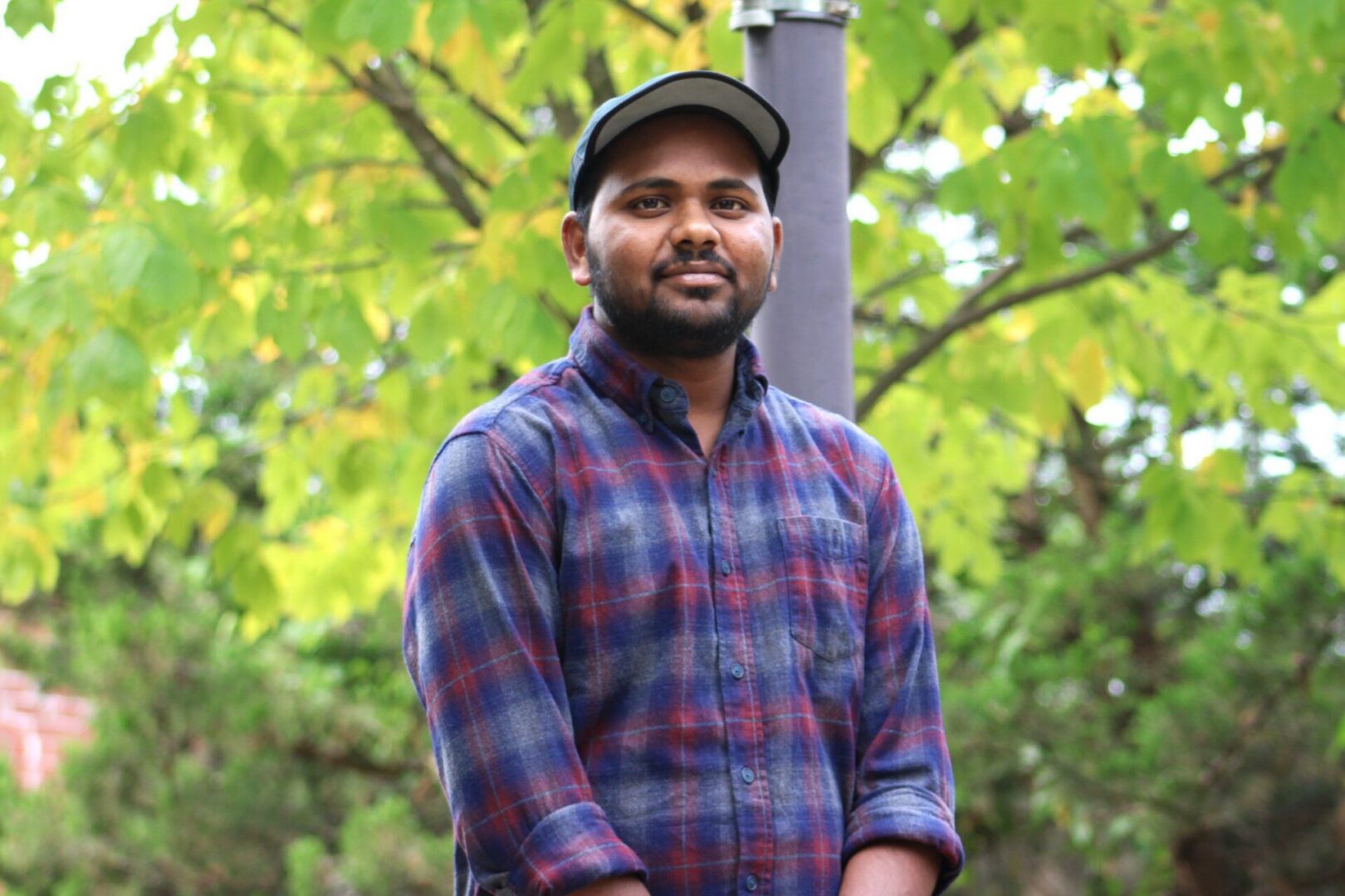 Man in plaid shirt outdoors