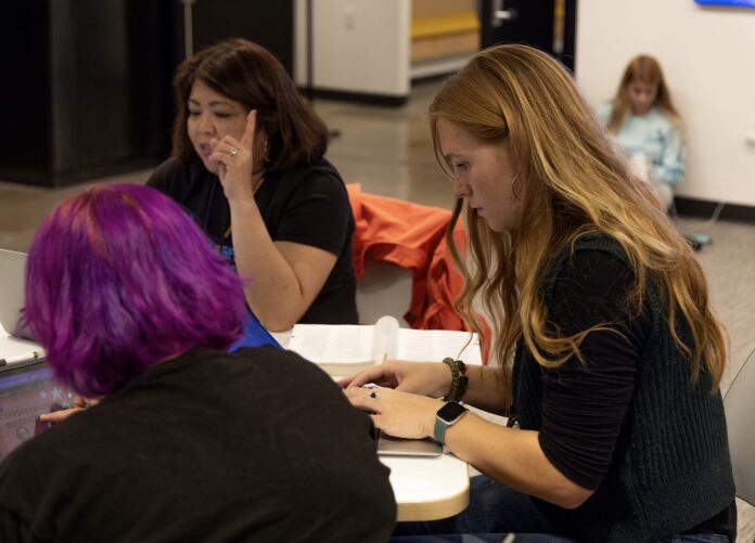 Women working together at a table