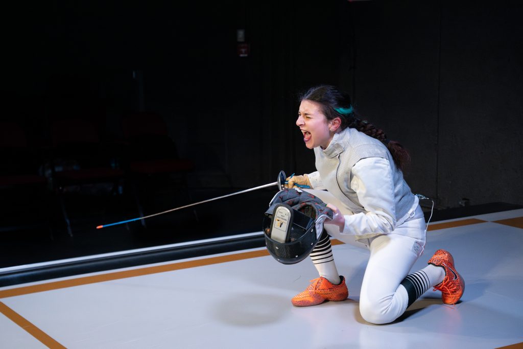 Fencer celebrating victory on the piste