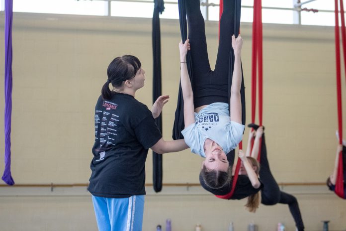 Aerial yoga practice with guidance