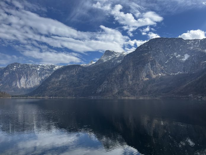 Snow-capped peaks by tranquil lake
