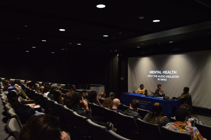 Audience attending mental health panel discussion