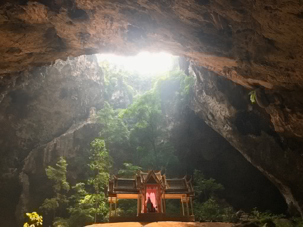 Temple illuminated by sunlight in cave