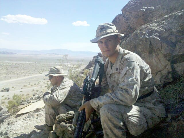 Military personnel with rifles outdoors
