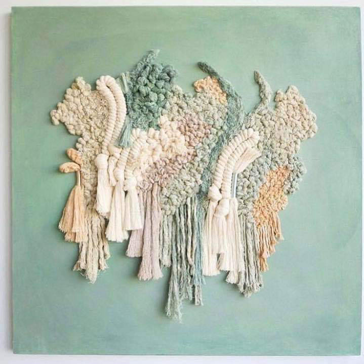 Abstract woven wall hanging with tassels