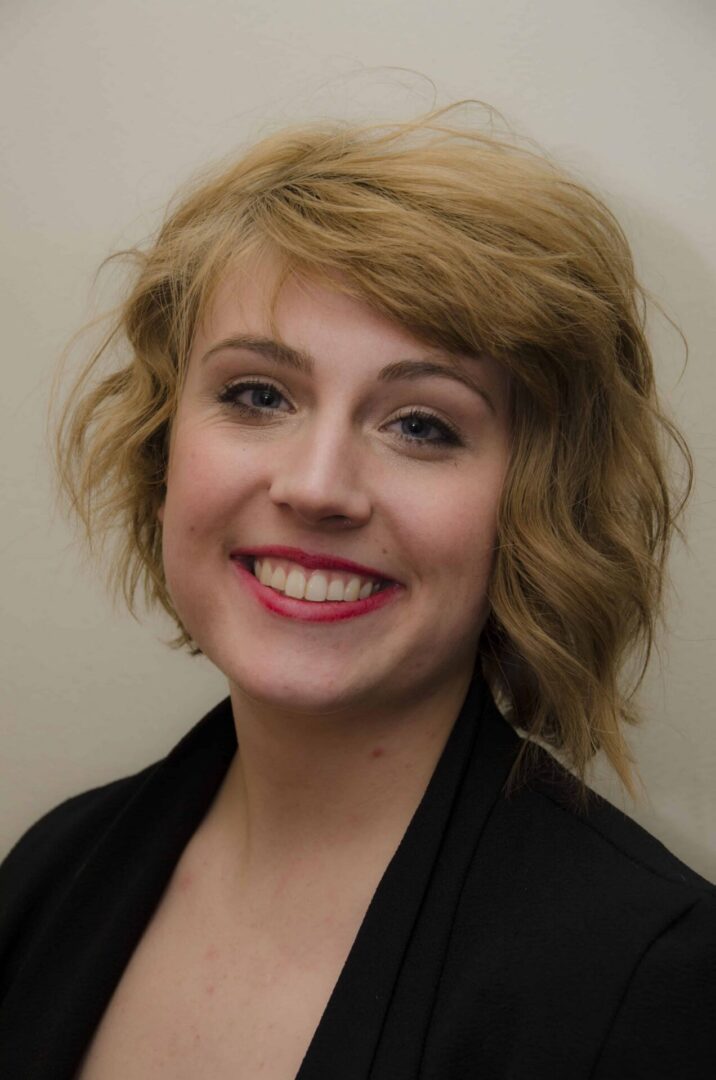 Portrait of woman in black jacket.