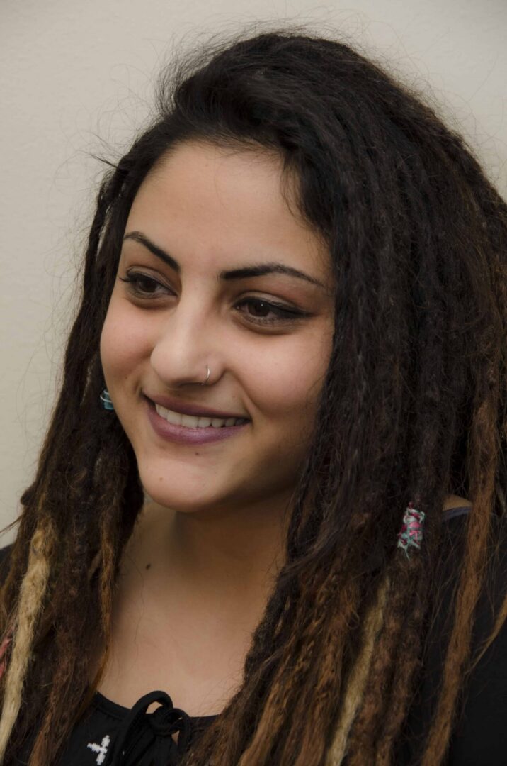 Woman with nose ring and dreadlocks
