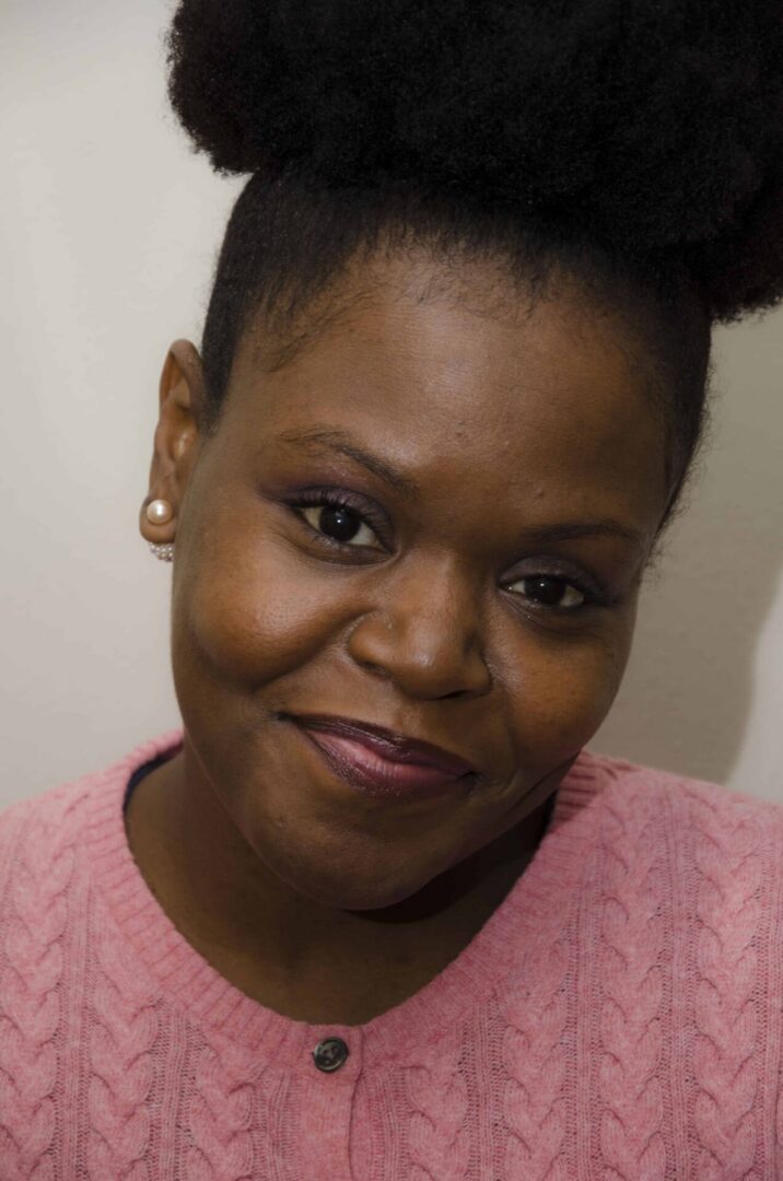 Smiling woman wearing pearl earrings