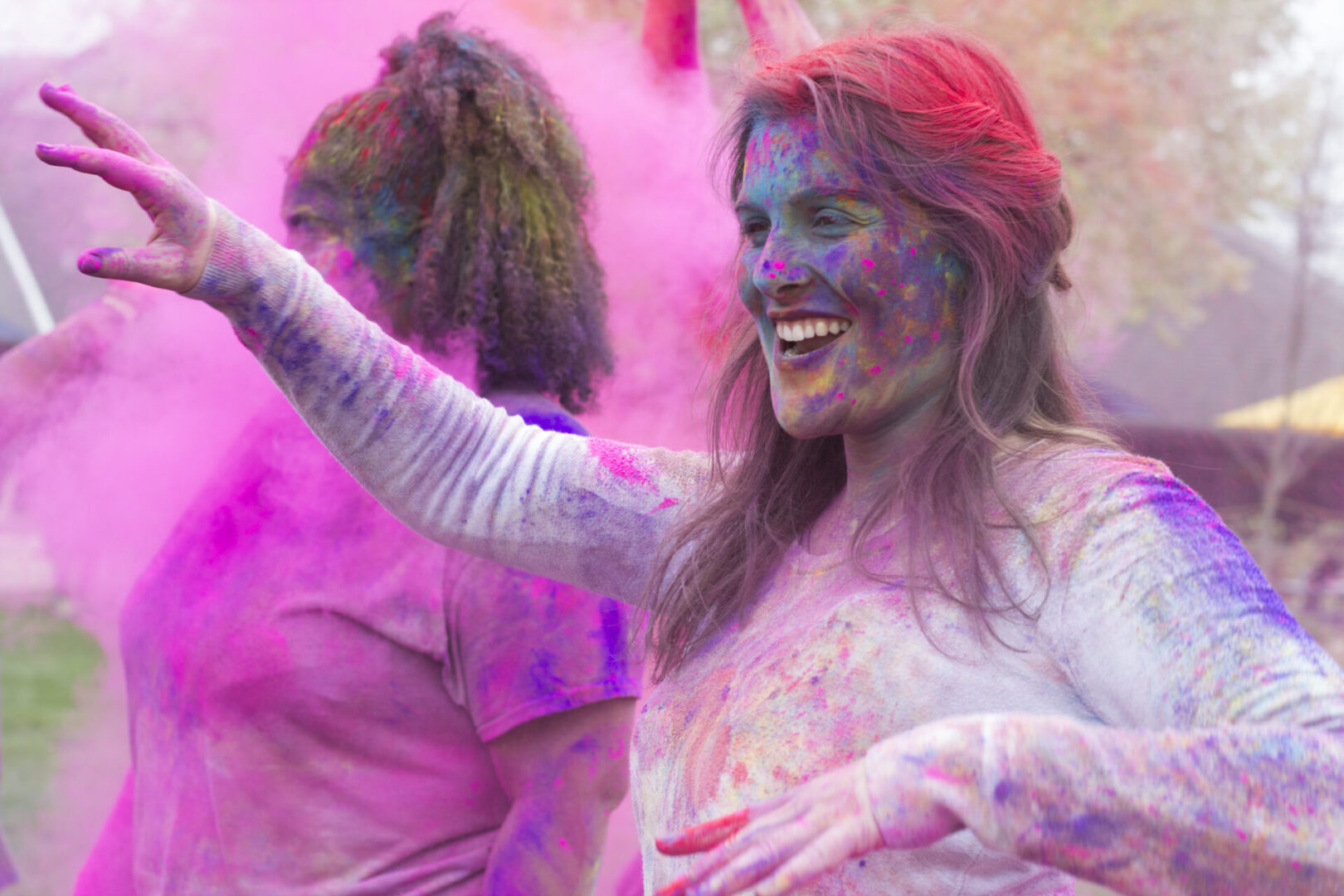 Women celebrating with colorful powder