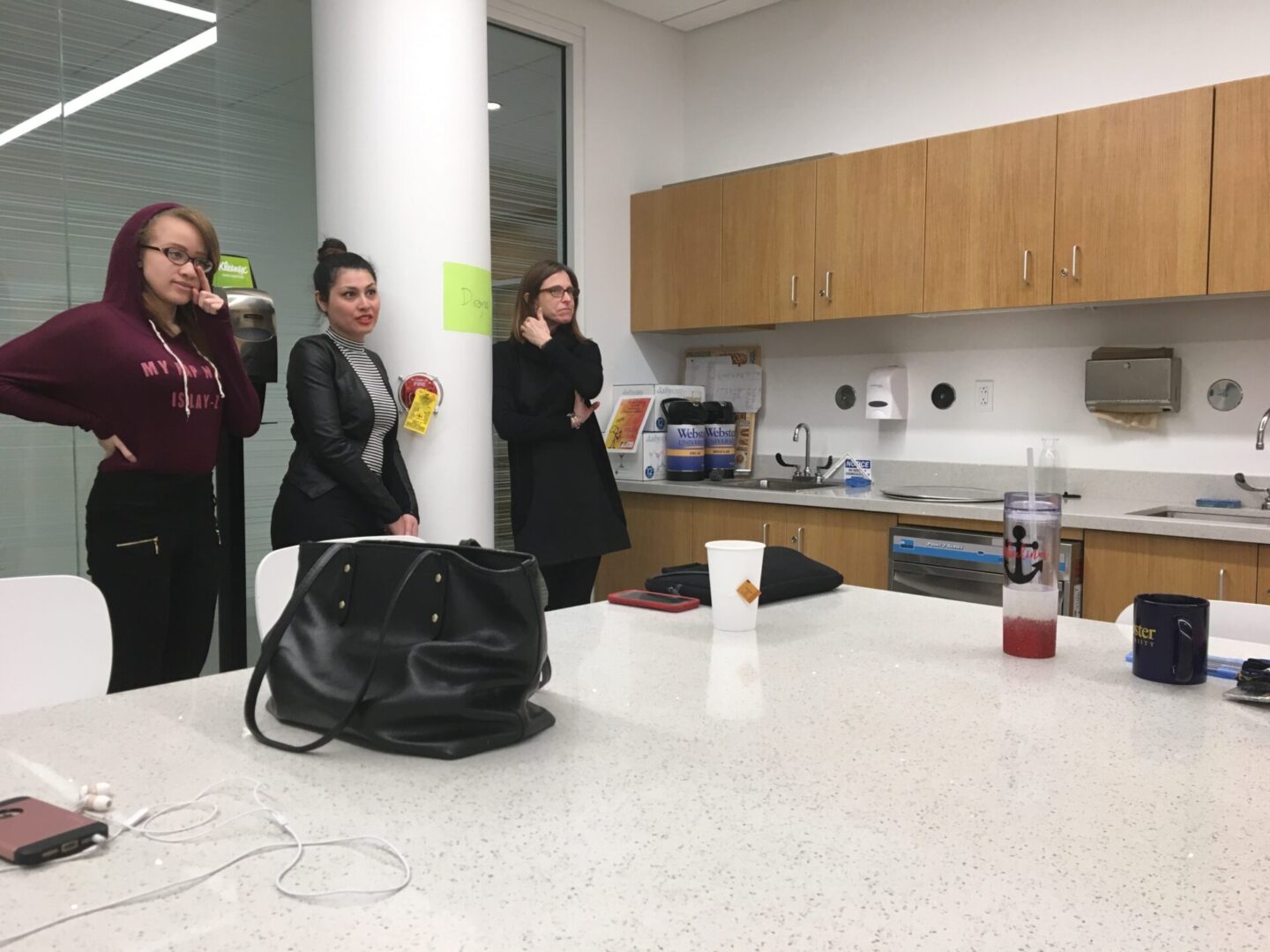 Women gathered in an office kitchen