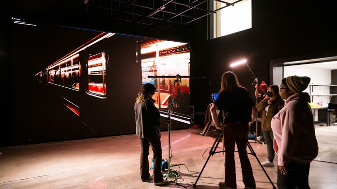 Crew setting up scene in studio