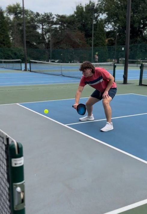 Young athlete focusing on pickleball game