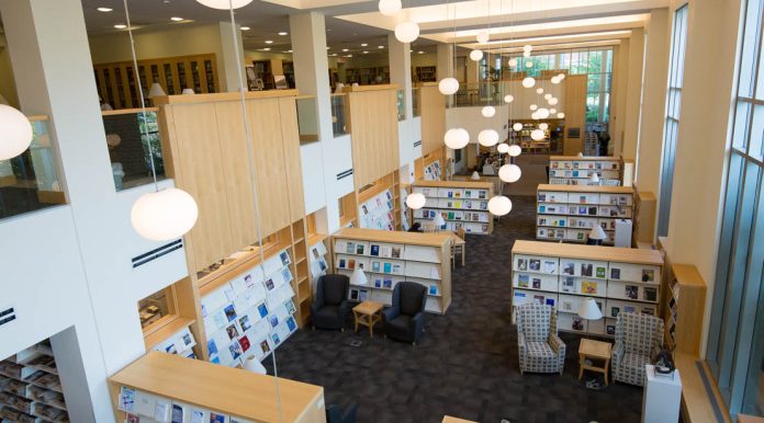 Modern library with bright lighting and books.