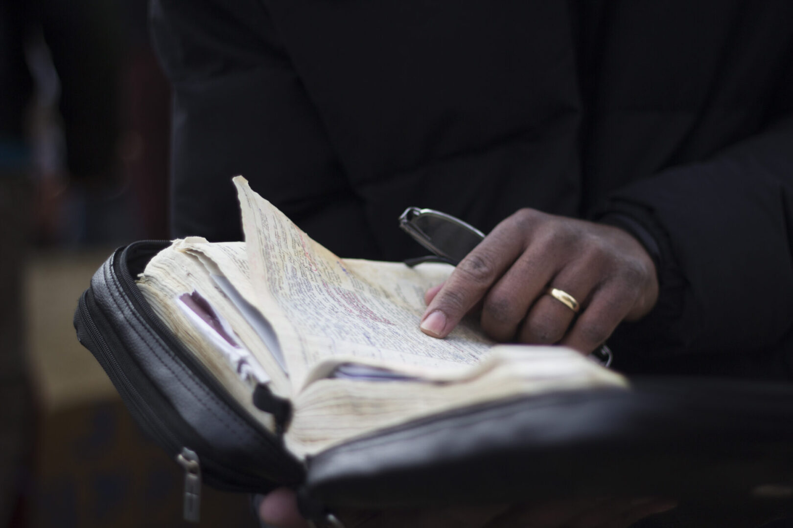 Close-up of book with notes and pen