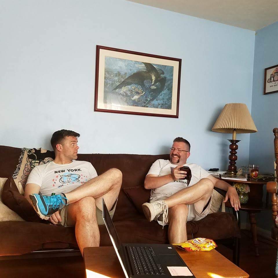 Friends relaxing with drinks at home