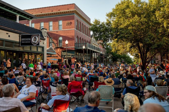 People enjoying outdoor festival downtown