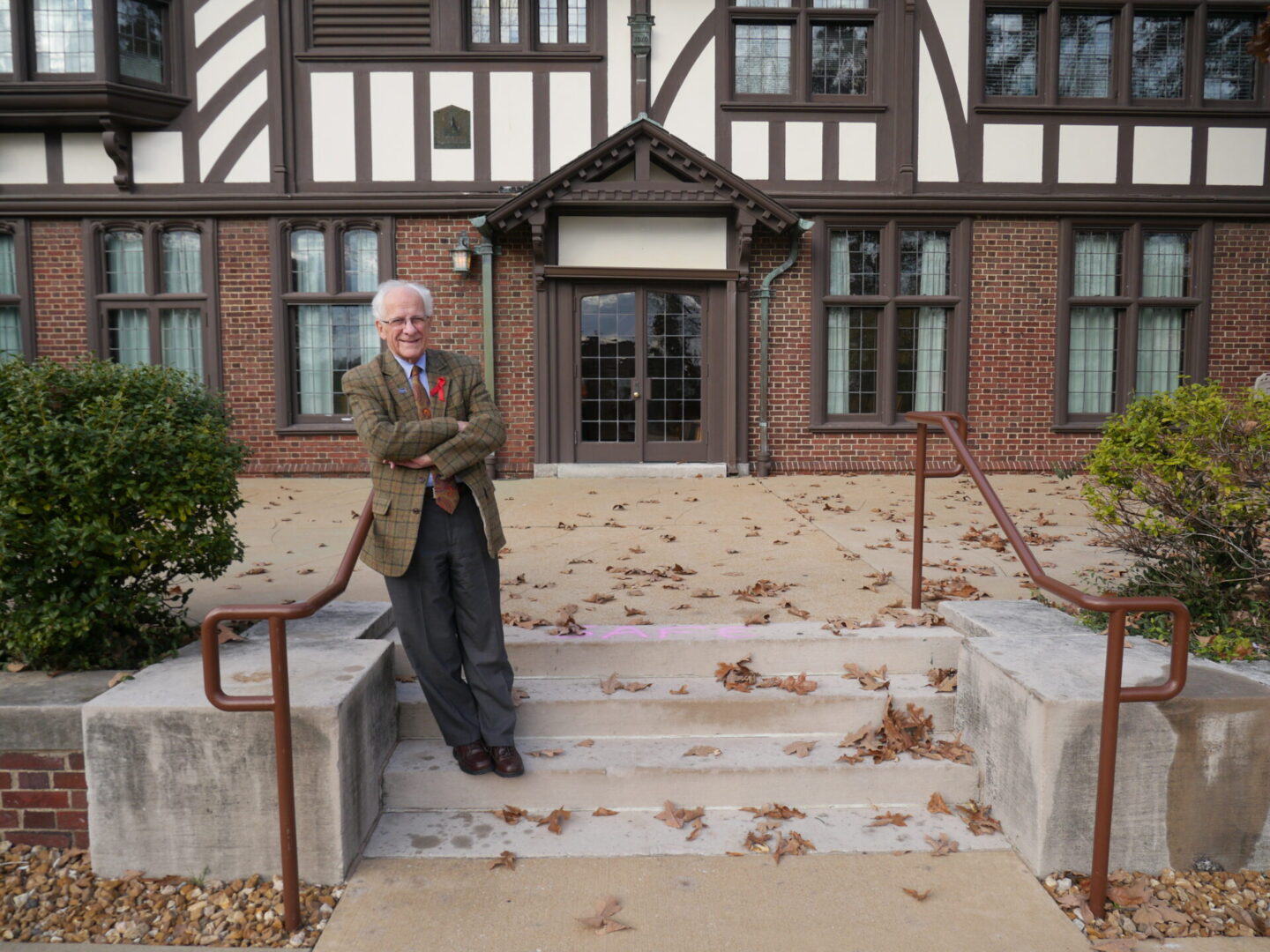 Gentleman posing in front of historic building