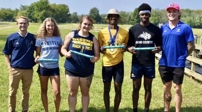 Track team posing on a sunny day