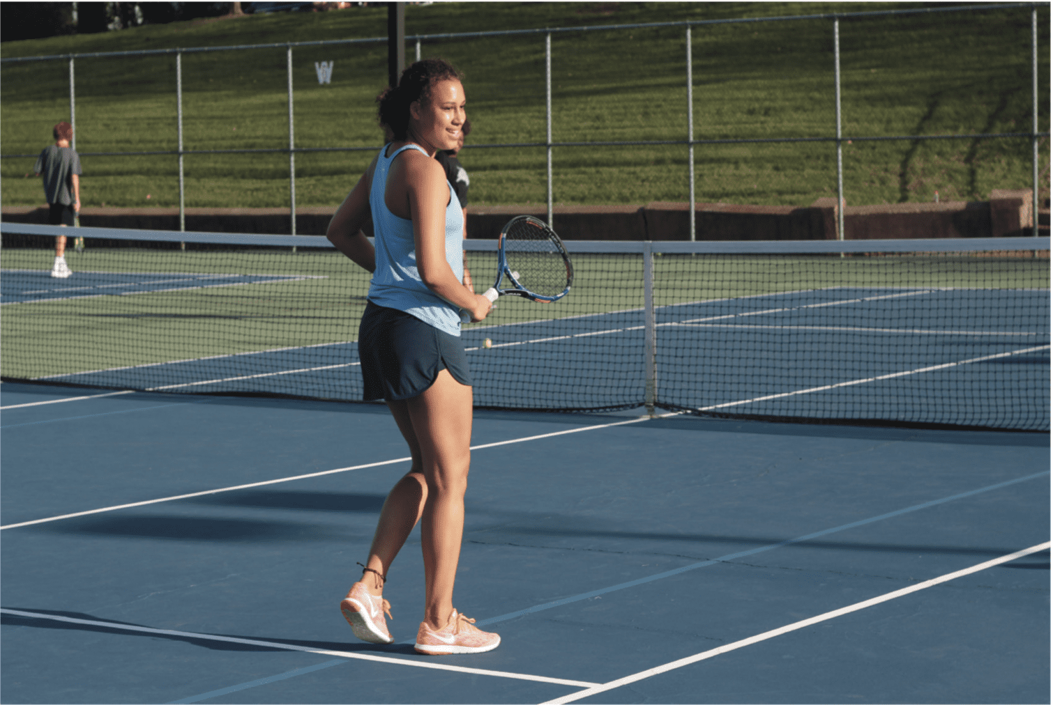 Athlete holding tennis racket on court