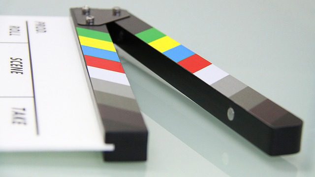 Movie scene clapperboard with color stripes