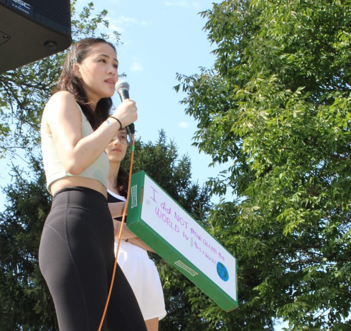 Woman speaking at outdoor rally