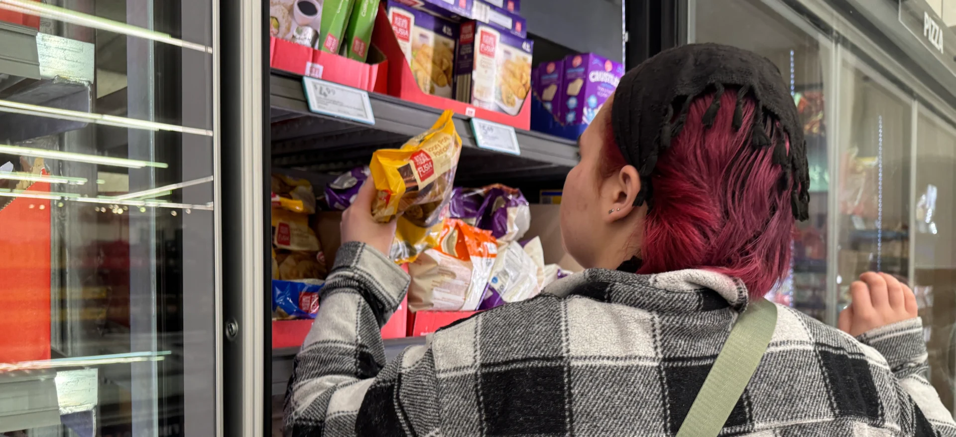 Individual choosing items in grocery store